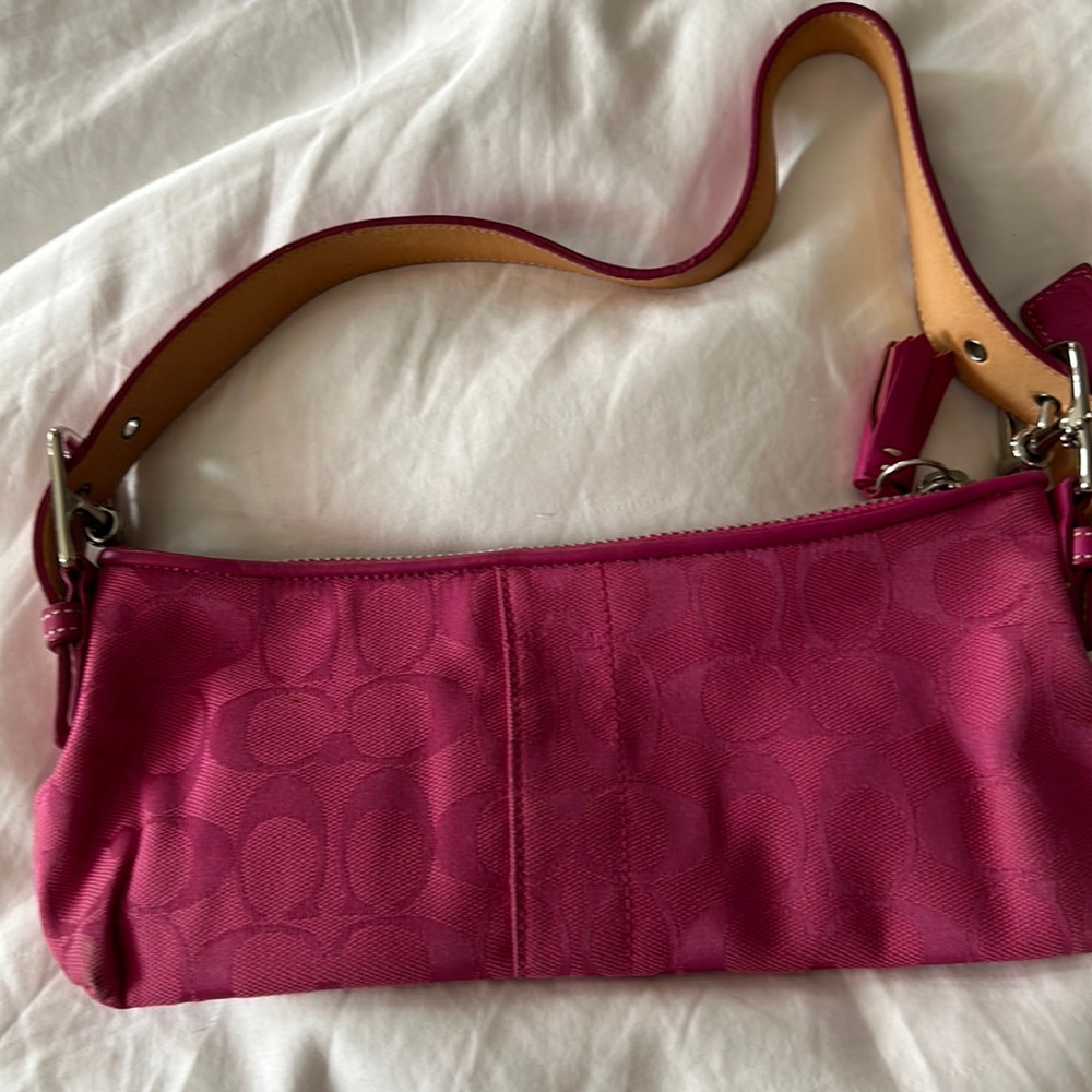 Authentic pink monogram Coach shoulder bag.